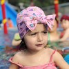 【泳帽】。可爱卡通儿童泳帽 腈纶宝宝蝴蝶结帽子弹力纯色印花宝宝泳帽 商品缩略图0