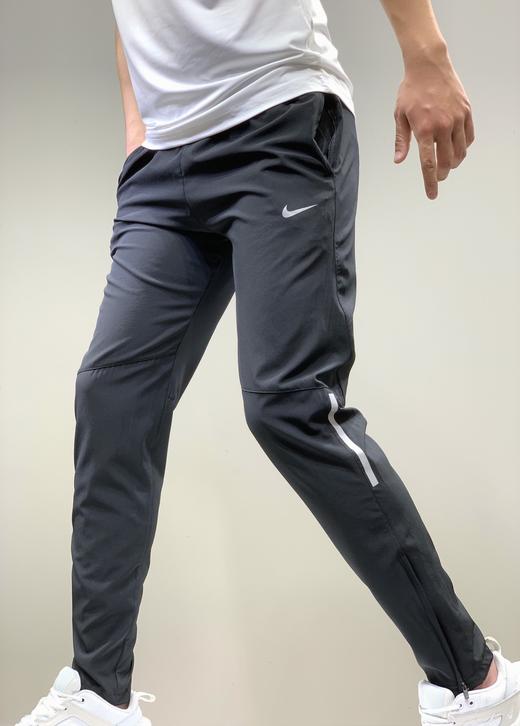 点此购买耐克男女超薄梭织速干运动裤左144993