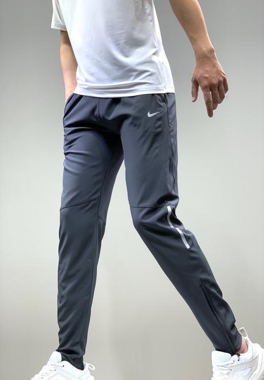 点此购买耐克男女超薄梭织速干运动裤左144993