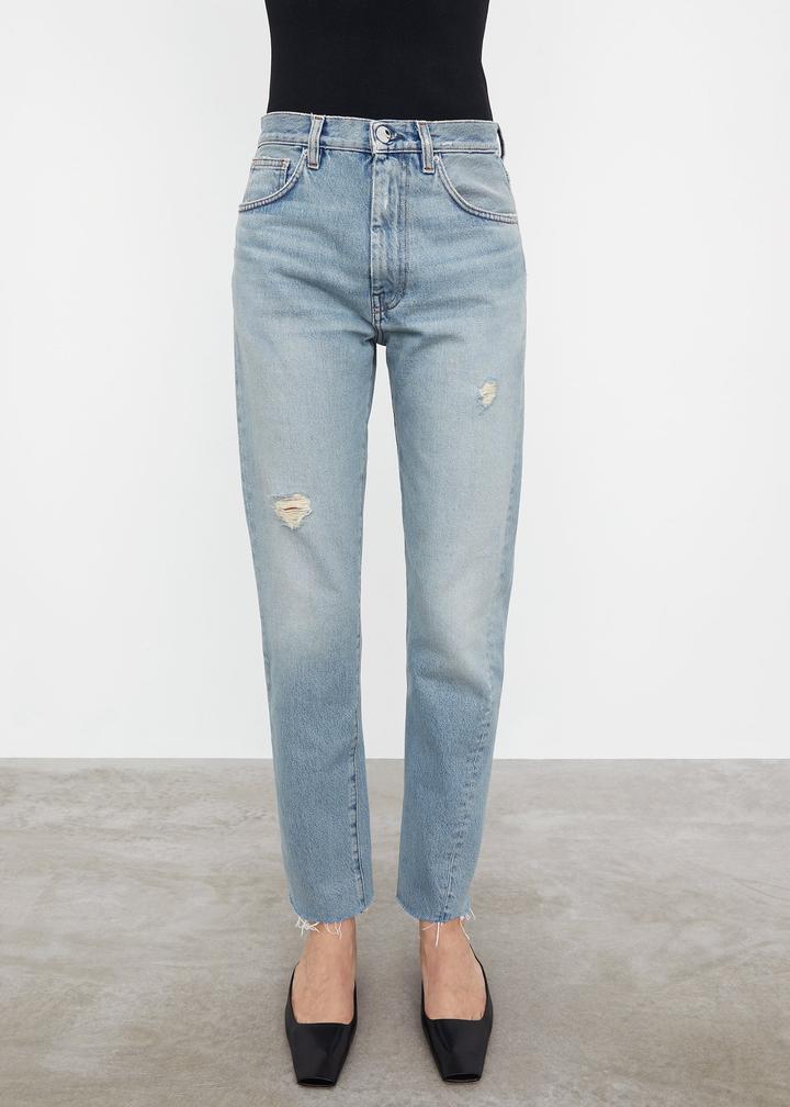 TOTEME 浅蓝色破洞斜裤线牛仔裤