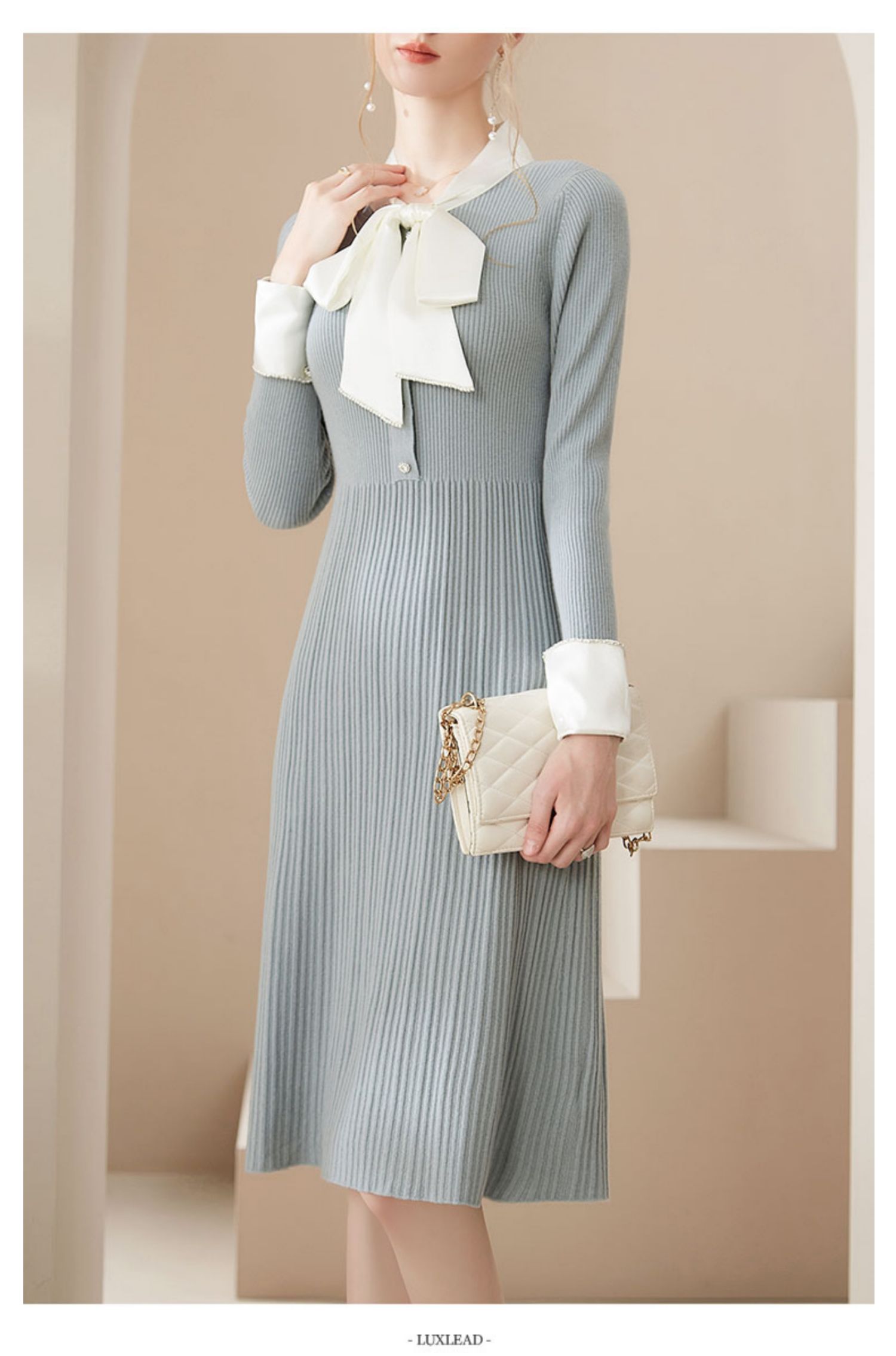 2021年新款法式气质蝴蝶结修身长袖过膝包臀春秋冬羊毛针织连衣裙