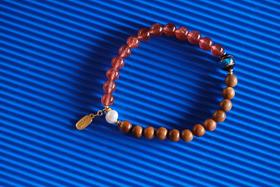 JSNM0142-3°金丝楠木草莓晶手串