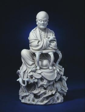 白釉鹤鹿仙人雕像