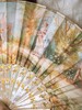 【已售】独角鹿西洋古董 1890年代法国Duvelleroy工坊签名创作描金母贝镂雕扇骨装饰钓鱼时光主题手绘扇面双面折扇 商品缩略图2