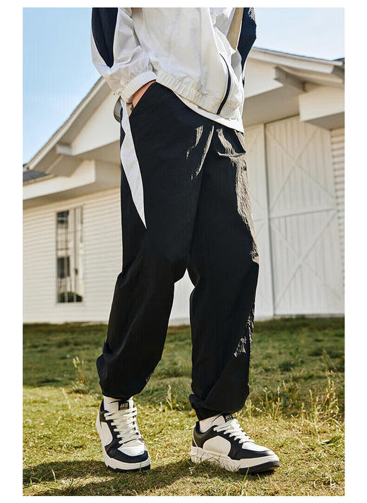 安踏（ANTA）【王一博同款】梭织运动长裤男美式复古休闲裤152438516 基础黑-1 商品图0