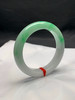 620057，57.8圈口，白底飘阳绿正圈平安镯，半截阳绿花色，底子细腻有水 商品缩略图1