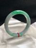 620120，58.6圈口，飘绿正圈平安镯，白底飘阳绿，色浓，底子细腻，有一处晶体纹 商品缩略图1