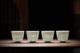 影青釉雕刻四大神兽杯
