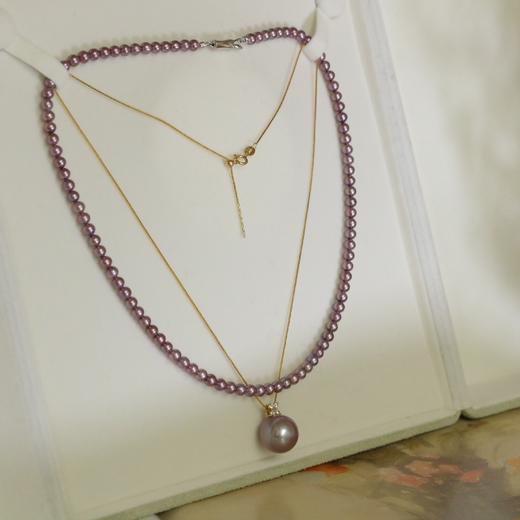 九紫离火运极品珍珠，吊坠13-14mm，极光完美无瑕。吊坠配件纯18k金。
加赠一串天然色浓紫色小项链4-5mm，无暇品质，视觉正圆，强光 商品图0