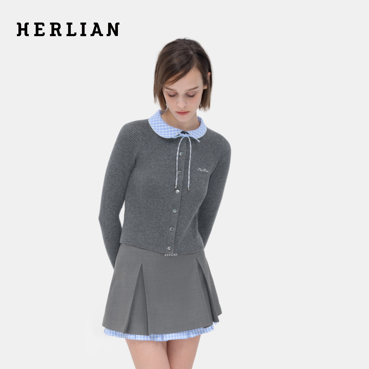 HERLIAN 2026年春季新品不对称领拼接女士长袖针织开衫上衣