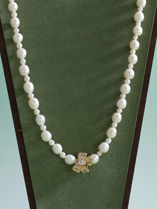 子佩集【结爱深长】珍珠惜王妃毛衣链【ZZMYL004】5-8.5mm珠镀金蝴蝶结2601 商品图5