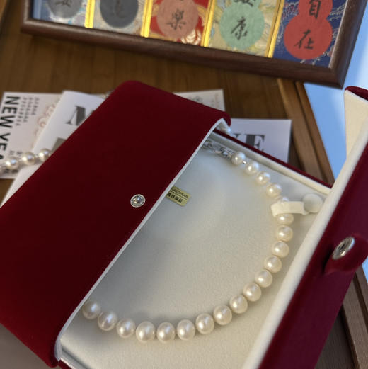 稀缺无核淡水珍珠的正圆珠 天然形状 瑕疵很少很干净 细微生长痕迹佩戴不影响 约10-11.5mm 总长度45cm 纯银扣 商品图1