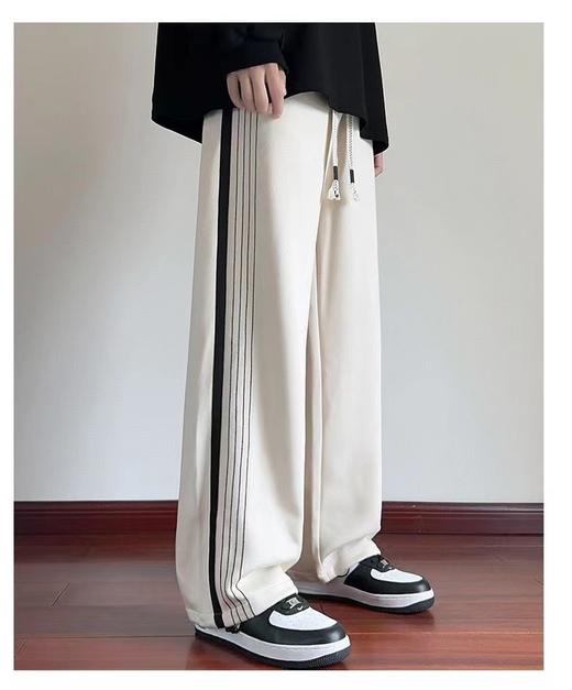 F031428时尚百搭纯色侧边拼接不对称条纹直筒学生休闲长裤 商品图1