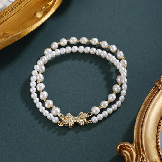 子佩集【珍爱情结】珍珠惜王妃手链【ZZSL003】4.5-6mm珠镀金蝴蝶结2601 商品图0