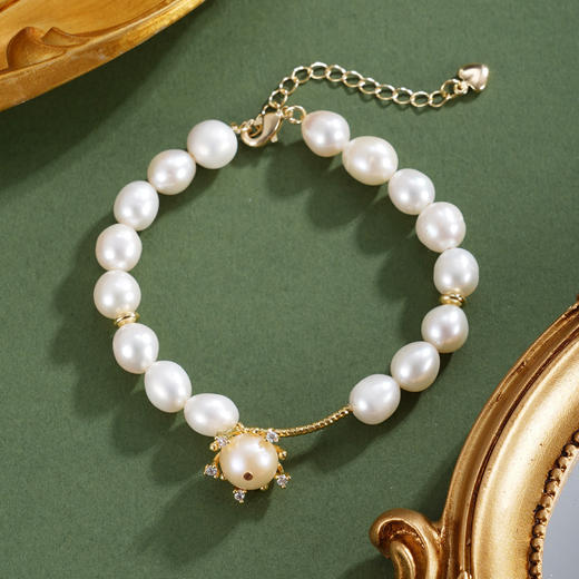 子佩集【岁华共守】珍珠惜王妃手链【ZZSL015】7.2*8.2mm珠镀金吊球2601 商品图0