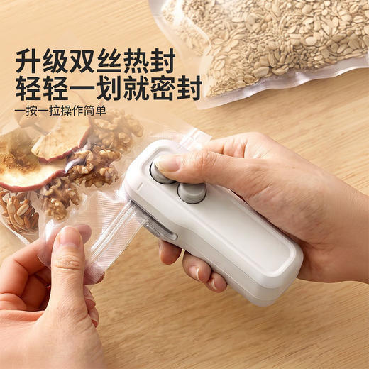 摩登主妇迷你封口机小型零食塑封袋密封神器家用手压式食品封口器 商品图1